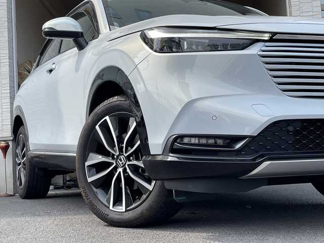 ホンダ ヴェゼル ハイブリッド e:HEV Z 大分県 2023(令5)年 2.5万km プレミアムサンライトホワイトパール ワンオーナー /ハーフレザーシート /全方位カメラ/おくだけ充電/デジタルインナーミラー/パワーバックドア/純正ナビ/フルセグTV/Bluetooth/純正フロアマット/純正18インチアルミホイール/純正ETC/純正ドラレコ/純正LEDヘッドライト/オートライト/衝突被害軽減ブレーキ/横滑り防止装置/レーンキープアシスト/コーナーセンサー