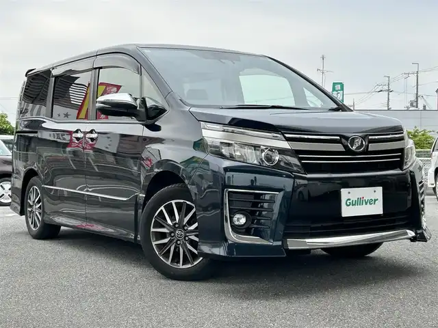 トヨタ ヴォクシー ZS 煌Ⅱ 奈良県 2016(平28)年 12.2万km ブラッキッシュアゲハガラスフレーク ワンオーナー/純正ナビ（NSZN-266T）/純正フリップダウン/純正16インチナビ/バックカメラ/フルセグTV/ブルートゥース/サンシェード/両側パワースライドドア/衝突軽減ブレーキ/スタットレス付き/電格ミラー/オートライト/フォグライト/保証書/取扱説明書