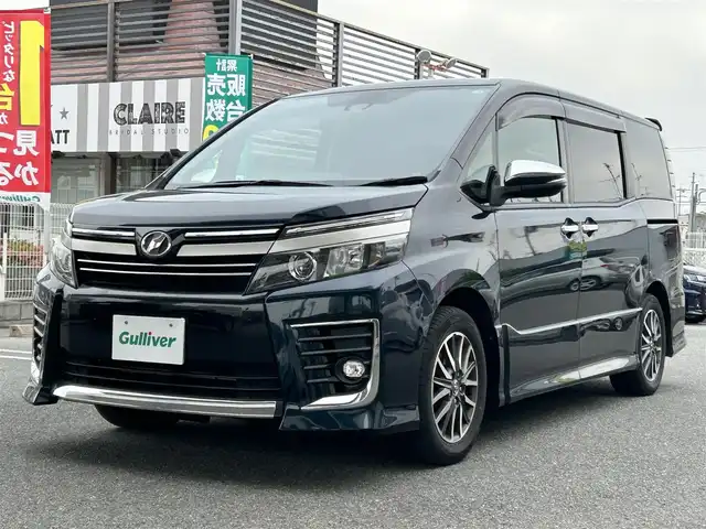 トヨタ ヴォクシー ZS 煌Ⅱ 奈良県 2016(平28)年 12.2万km ブラッキッシュアゲハガラスフレーク ワンオーナー/純正ナビ（NSZN-266T）/純正フリップダウン/純正16インチナビ/バックカメラ/フルセグTV/ブルートゥース/サンシェード/両側パワースライドドア/衝突軽減ブレーキ/スタットレス付き/電格ミラー/オートライト/フォグライト/保証書/取扱説明書