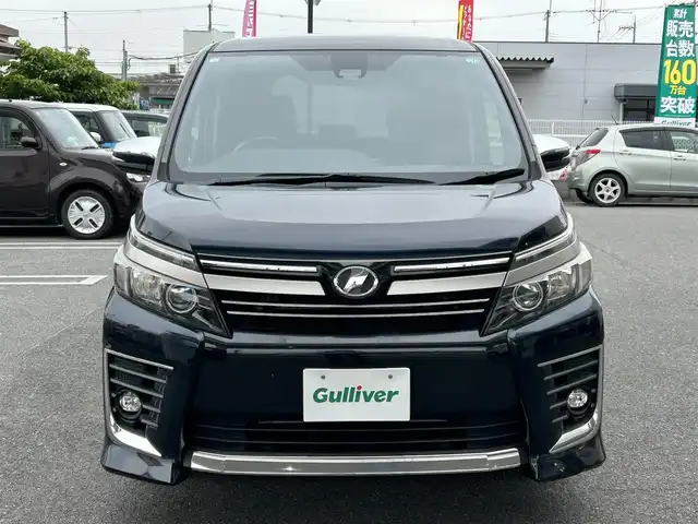 トヨタ ヴォクシー ZS 煌Ⅱ 奈良県 2016(平28)年 12.2万km ブラッキッシュアゲハガラスフレーク ワンオーナー/純正ナビ（NSZN-266T）/純正フリップダウン/純正16インチナビ/バックカメラ/フルセグTV/ブルートゥース/サンシェード/両側パワースライドドア/衝突軽減ブレーキ/スタットレス付き/電格ミラー/オートライト/フォグライト/保証書/取扱説明書
