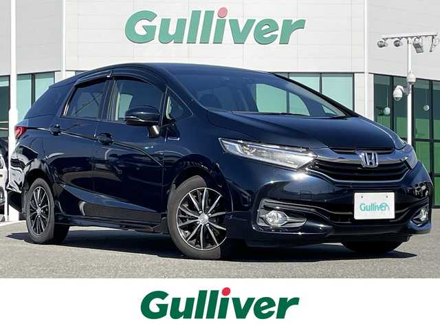 ホンダ シャトル ハイブリッド X スタイルエディション 佐賀県 2016(平28)年 9.4万km ミッドナイトブルービームM 純正メモリーナビゲーション/・フルセグTV/CD/DVD/SD/USB/Bluetooth/バックカメラ/前方ドライブレコーダー/ビルトインETC/ハーフレザーシート/ISOFIX対応/革巻きステアリング/ステアリングリモコン/社外15インチアルミホイール/純正LEDヘッドライト/純正フォグランプ/純正フロアマット/純正ドアバイザ―/新車保証書/取扱説明書/スペアキー１本/クルーズコントロール/シティブレーキアクティブシステム/横滑り防止装置