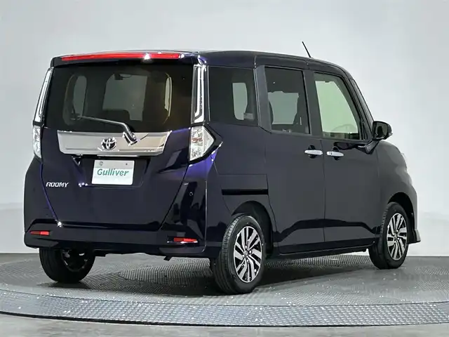 トヨタ ルーミー カスタムG 愛媛県 2023(令5)年 0.2万km クールバイオレットクリスタルシャイン ・９型ディスプレイオーディオ/（ＢＴ・フルセグＴＶ・ＦＭＡＭ・ＡｐｐｌｅＣａｒｐｌａｙ・ＡｎｄｒｏｉｄＡｕｔｏ・ＵＳＢ接続）/・全方位カメラ　/・前後ドライブレコーダー　/・レーダークルーズコントロール　/・両側パワースライドドア/・衝突軽減ブレーキ/・前後コーナーセンサー/・リヤドアサンシェード/・スペアキー