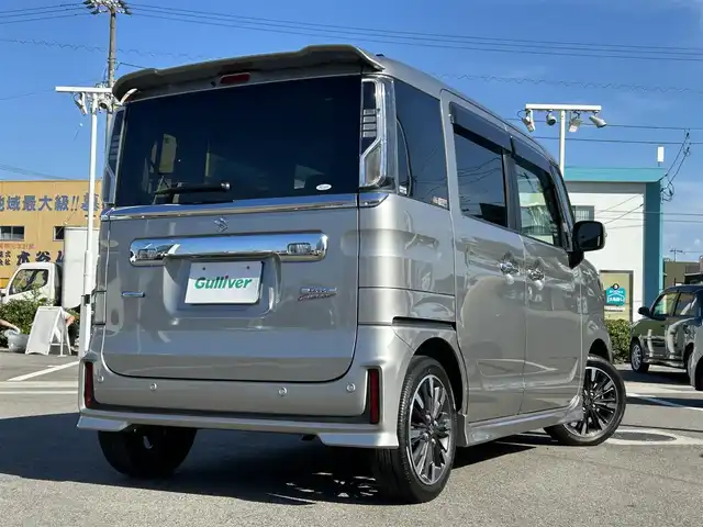 スズキ スペーシア カスタム HYBRID XS 愛媛県 2021(令3)年 2.1万km スチールシルバーM 登録時走行距離：20290Km/社外ディーラーOPメモリナビ/ワンセグTV/DVD/ETC/両側パワースライドドア/サンシェード/アイドリングストップ/横滑り防止装置/レーダークルーズコントロール/レーンキープアシスト/パーキングアシスト/衝突軽減システム/LEDヘッドライト/オートライト/エンジンスタートボタン/ベンチシート/シートヒーター/スマートキー/純正アルミホイール/純正フロアマット