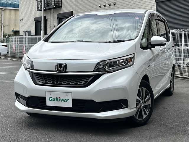 ホンダ フリード ハイブリット G ホンダセンシング 茨城県 2020(令2)年 6.7万km プラチナホワイトパール 純正ナビ/(Gathers/VXM-207VFNi)/フルセグＴＶ　ＢＴ　ＣＤ／ＤＶＤ　/純正フリップダウンモニター/前席シートヒーター　/ホンダセンシング　/レーンキープアシスト/コーナーセンサー/クルーズコントロール/オートドアミラー/アクティブコーナリングライト/LEDヘッドライト/プラズマクラスター/両側パワスラ　/バックカメラ/３列シート　/チップアップシート　　/ビルトインＥＴＣ/保証書/取扱説明書/点検記録簿