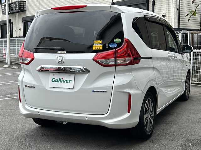 ホンダ フリード ハイブリット G ホンダセンシング 茨城県 2020(令2)年 6.7万km プラチナホワイトパール 純正ナビ/(Gathers/VXM-207VFNi)/フルセグＴＶ　ＢＴ　ＣＤ／ＤＶＤ　/純正フリップダウンモニター/前席シートヒーター　/ホンダセンシング　/レーンキープアシスト/コーナーセンサー/クルーズコントロール/オートドアミラー/アクティブコーナリングライト/LEDヘッドライト/プラズマクラスター/両側パワスラ　/バックカメラ/３列シート　/チップアップシート　　/ビルトインＥＴＣ/保証書/取扱説明書/点検記録簿