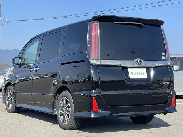 トヨタ ノア Si ダブルバイビー 佐賀県 2018(平30)年 4.1万km ブラック 純正9インチSDナビゲーション/・フルセグTV/CD/DVD/SD/Bluetooth/フリップダウンモニター/バックカメラ/前方ドライブレコーダー/ビルトインETC/両側パワースライドドア/後席エアコン/後席サンシェード/ISOFIX対応/革巻きステアリング/ステアリングリモコン/純正16インチアルミホイール/純正LEDヘッドライト/・オートマチックハイビーム/純正LEDフォグランプ/純正フロアマット/新車保証書/取扱説明書/トヨタセーフティセンスC/・クルーズコントロール/・プリクラッシュセーフティ/・レーンディパーチャーアラート/・アイドリングストップ