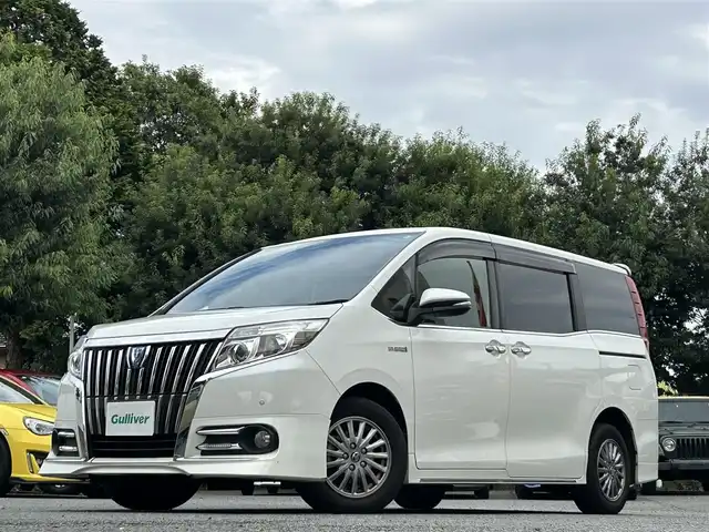 トヨタ エスクァイア ハイブリッド Gi 東京都 2014(平26)年 9.6万km ホワイトパールクリスタルシャイン 両側パワースライドドア/社外ナビ/Bluetoothオーディオ／ＤＶＤ再生／フルセグTV/フリップダウンモニター/RSA10S-L　アルパイン製/前後ドライブレコーダー/ZDR-015/ETC/前席シートヒーター/リアオートエアコン/LEDヘッドランプ/置くだけ充電/スマートキー×2