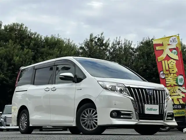 トヨタ エスクァイア ハイブリッド Gi 東京都 2014(平26)年 9.6万km ホワイトパールクリスタルシャイン 両側パワースライドドア/社外ナビ/Bluetoothオーディオ／ＤＶＤ再生／フルセグTV/フリップダウンモニター/RSA10S-L　アルパイン製/前後ドライブレコーダー/ZDR-015/ETC/前席シートヒーター/リアオートエアコン/LEDヘッドランプ/置くだけ充電/スマートキー×2