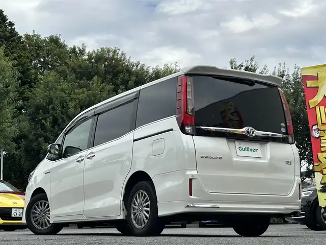 トヨタ エスクァイア ハイブリッド Gi 東京都 2014(平26)年 9.6万km ホワイトパールクリスタルシャイン 両側パワースライドドア/社外ナビ/Bluetoothオーディオ／ＤＶＤ再生／フルセグTV/フリップダウンモニター/RSA10S-L　アルパイン製/前後ドライブレコーダー/ZDR-015/ETC/前席シートヒーター/リアオートエアコン/LEDヘッドランプ/置くだけ充電/スマートキー×2