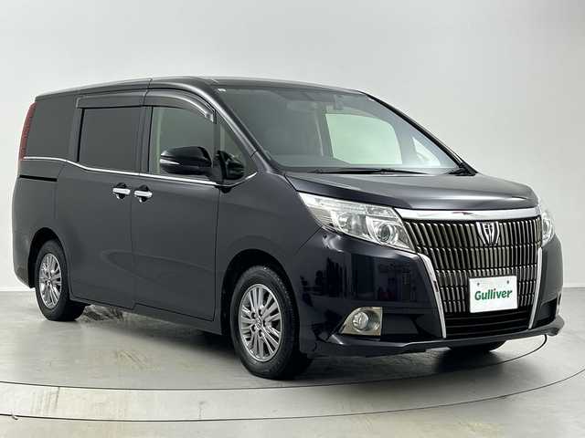 トヨタ エスクァイア Gi 福島県 2015(平27)年 6.5万km スパークリングブラックパールクリスタルシャイン /禁煙車//純正11インチフリップダウンモニター/【V11T-R62C】//クルーズコントロール//純正7インチナビ/・BT.CD.DVD.SD/・フルセグTV//バックカメラ//両側パワースライドドア//ビルトインETC//ドライブレコーダー（FR）//合皮シート/・前席シートヒーター//ステアリングスイッチ//プッシュスタート//スマートキー//LEDヘッドライト//フォグライト//純正15インチAW//夏タイヤ積み込み/【社外AW（195/65/15）】//純正ドアバイザー//社外フロアマット