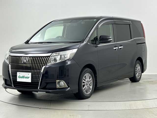 トヨタ エスクァイア Gi 福島県 2015(平27)年 6.5万km スパークリングブラックパールクリスタルシャイン /禁煙車//純正11インチフリップダウンモニター/【V11T-R62C】//クルーズコントロール//純正7インチナビ/・BT.CD.DVD.SD/・フルセグTV//バックカメラ//両側パワースライドドア//ビルトインETC//ドライブレコーダー（FR）//合皮シート/・前席シートヒーター//ステアリングスイッチ//プッシュスタート//スマートキー//LEDヘッドライト//フォグライト//純正15インチAW//夏タイヤ積み込み/【社外AW（195/65/15）】//純正ドアバイザー//社外フロアマット