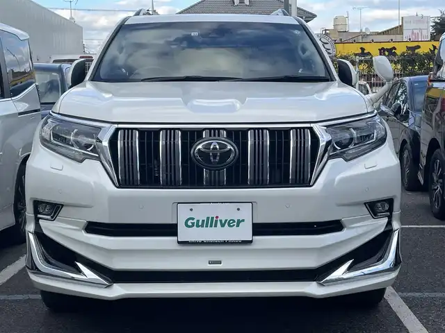 トヨタ ランドクルーザー プラド TX Lパッケージ 千葉県 2022(令4)年 4万km ホワイトパールクリスタルシャイン ワンオーナー/モデリスタフロントエアロ/モデリスタリアエアロ/モデリスタリアスポイラー/モデリスタマフラー/純正19インチアルミホイール/純正9インチナビ/クルーズコントロール/パワーバックドア/プッシュスタート/センターデフロック /ダウンヒルアシスト機能/オートハイビーム/ETC2.0/ヘッドライトウォッシャー/アイドルアップ（寒冷地仕様）/ヒルスタートアシスト/2nd START（雪道・泥道向け）/切替４WD/ドアバイザー/電動格納ミラー/ウィンカーミラー/保証書/取扱説明書、ナビ説明書