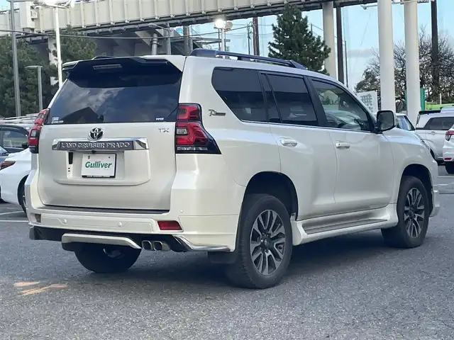 トヨタ ランドクルーザー プラド TX Lパッケージ 千葉県 2022(令4)年 4万km ホワイトパールクリスタルシャイン ワンオーナー/モデリスタフロントエアロ/モデリスタリアエアロ/モデリスタリアスポイラー/モデリスタマフラー/純正19インチアルミホイール/純正9インチナビ/クルーズコントロール/パワーバックドア/プッシュスタート/センターデフロック /ダウンヒルアシスト機能/オートハイビーム/ETC2.0/ヘッドライトウォッシャー/アイドルアップ（寒冷地仕様）/ヒルスタートアシスト/2nd START（雪道・泥道向け）/切替４WD/ドアバイザー/電動格納ミラー/ウィンカーミラー/保証書/取扱説明書、ナビ説明書