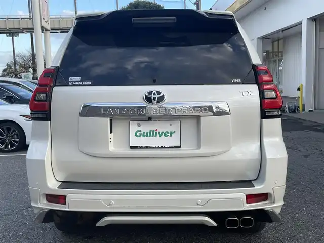 トヨタ ランドクルーザー プラド TX Lパッケージ 千葉県 2022(令4)年 4万km ホワイトパールクリスタルシャイン ワンオーナー/モデリスタフロントエアロ/モデリスタリアエアロ/モデリスタリアスポイラー/モデリスタマフラー/純正19インチアルミホイール/純正9インチナビ/クルーズコントロール/パワーバックドア/プッシュスタート/センターデフロック /ダウンヒルアシスト機能/オートハイビーム/ETC2.0/ヘッドライトウォッシャー/アイドルアップ（寒冷地仕様）/ヒルスタートアシスト/2nd START（雪道・泥道向け）/切替４WD/ドアバイザー/電動格納ミラー/ウィンカーミラー/保証書/取扱説明書、ナビ説明書