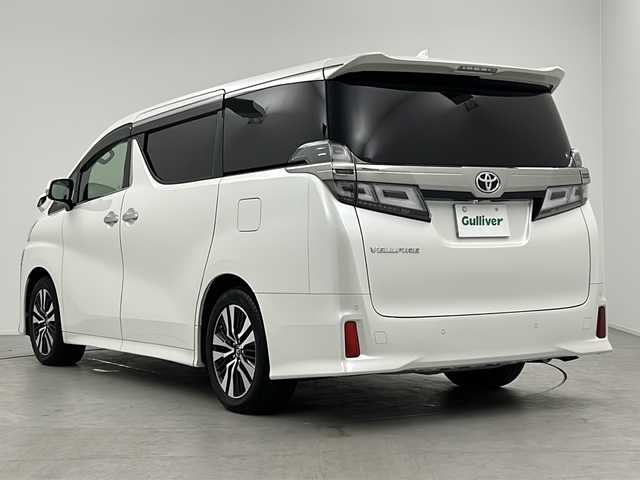 トヨタ ヴェルファイア Z Gエディション 三重県 2018(平30)年 5.7万km ホワイトパールクリスタルシャイン ツインムーンルーフ/トヨタセーフティセンス/・プリクラッシュセーフティ/・レーンディパーチャーアラート/・オートマチックハイビーム/・ロードサインアシスト/・先行車発進告知/レーダークルーズコントロール/クリアランスソナー/両側パワースライドドア/アルパインナビ１１型BIGX：EX11Z/・フルセグ/CD/DVD/SD/Bluetooth/バックカメラ/革巻きステアリング/ステアリングスイッチ/ステアリングヒーター/パワーバックドア/合皮シート/シートヒーター/ベンチレーション/パワーシート/オットマン/LEDヘッドライト/フォグランプ/前後ドライブレコーダー（ZDR-015）/ETC/純正18インチアルミホイール/W+サイド+カーテンエアバック