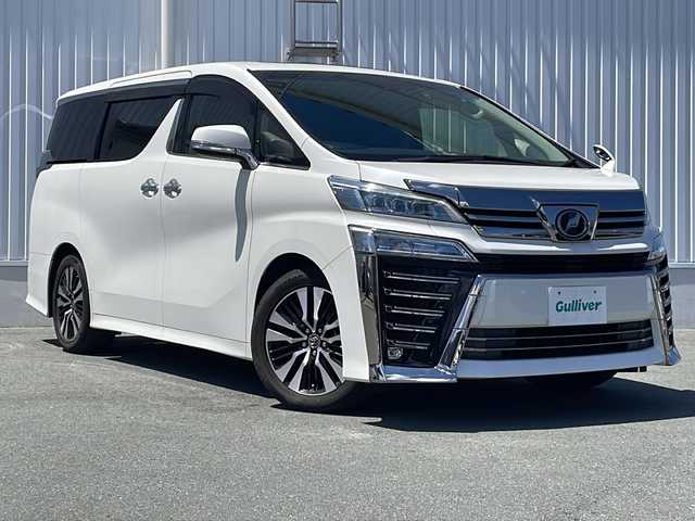 トヨタ ヴェルファイア Z Gエディション 三重県 2018(平30)年 5.7万km ホワイトパールクリスタルシャイン ツインムーンルーフ/トヨタセーフティセンス/・プリクラッシュセーフティ/・レーンディパーチャーアラート/・オートマチックハイビーム/・ロードサインアシスト/・先行車発進告知/レーダークルーズコントロール/クリアランスソナー/両側パワースライドドア/アルパインナビ１１型BIGX：EX11Z/・フルセグ/CD/DVD/SD/Bluetooth/バックカメラ/革巻きステアリング/ステアリングスイッチ/ステアリングヒーター/パワーバックドア/合皮シート/シートヒーター/ベンチレーション/パワーシート/オットマン/LEDヘッドライト/フォグランプ/前後ドライブレコーダー（ZDR-015）/ETC/純正18インチアルミホイール/W+サイド+カーテンエアバック
