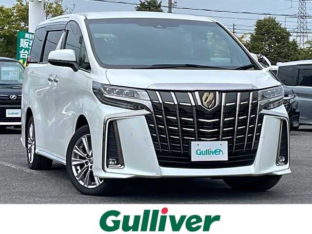 トヨタ アルファード S タイプゴールド 道央・札幌 2021(令3)年 7.2万km ホワイトパールクリスタルシャイン ４WD/純正メーカーナビ/CD/DVD/BT/フルセグ/純正フリップダウンモニター/トヨタセーフティセンス/プリクラッシュセーフティ/横滑り防止装置/レーダークルーズコントロール/レーンキープアシスト/クリアランスソナー/パーキングサポートブレーキ/ロードサインアシスト/バックカメラ/ビルトインETC/ドライブレコーダー/アイドリングストップ/ECOMODE/両側パワースライドドア/パワーバックドア/ハーフレザーシート/2列目オットマン/革巻きウッドコンビステアリング/ステアリングリモコン/電動パーキング/ブレーキホールド/MTモード付AT/プッシュスタート/スマートキー/LEDヘッドライト/オートライト/オートハイビーム/フォグランプ/電動格納ミラー/ウィンカーミラー/純正フロアマット/ドアバイザー/スペアキー