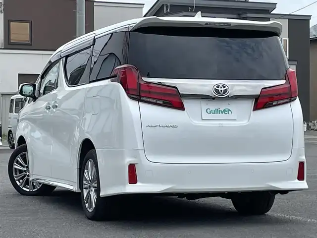 トヨタ アルファード S タイプゴールド 道央・札幌 2021(令3)年 7.2万km ホワイトパールクリスタルシャイン ４WD/純正メーカーナビ/CD/DVD/BT/フルセグ/純正フリップダウンモニター/トヨタセーフティセンス/プリクラッシュセーフティ/横滑り防止装置/レーダークルーズコントロール/レーンキープアシスト/クリアランスソナー/パーキングサポートブレーキ/ロードサインアシスト/バックカメラ/ビルトインETC/ドライブレコーダー/アイドリングストップ/ECOMODE/両側パワースライドドア/パワーバックドア/ハーフレザーシート/2列目オットマン/革巻きウッドコンビステアリング/ステアリングリモコン/電動パーキング/ブレーキホールド/MTモード付AT/プッシュスタート/スマートキー/LEDヘッドライト/オートライト/オートハイビーム/フォグランプ/電動格納ミラー/ウィンカーミラー/純正フロアマット/ドアバイザー/スペアキー