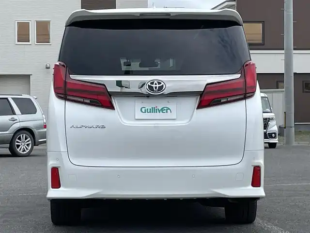 トヨタ アルファード S タイプゴールド 道央・札幌 2021(令3)年 7.2万km ホワイトパールクリスタルシャイン ４WD/純正メーカーナビ/CD/DVD/BT/フルセグ/純正フリップダウンモニター/トヨタセーフティセンス/プリクラッシュセーフティ/横滑り防止装置/レーダークルーズコントロール/レーンキープアシスト/クリアランスソナー/パーキングサポートブレーキ/ロードサインアシスト/バックカメラ/ビルトインETC/ドライブレコーダー/アイドリングストップ/ECOMODE/両側パワースライドドア/パワーバックドア/ハーフレザーシート/2列目オットマン/革巻きウッドコンビステアリング/ステアリングリモコン/電動パーキング/ブレーキホールド/MTモード付AT/プッシュスタート/スマートキー/LEDヘッドライト/オートライト/オートハイビーム/フォグランプ/電動格納ミラー/ウィンカーミラー/純正フロアマット/ドアバイザー/スペアキー