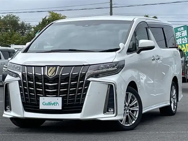 トヨタ アルファード S タイプゴールド 道央・札幌 2021(令3)年 7.2万km ホワイトパールクリスタルシャイン ４WD/純正メーカーナビ/CD/DVD/BT/フルセグ/純正フリップダウンモニター/トヨタセーフティセンス/プリクラッシュセーフティ/横滑り防止装置/レーダークルーズコントロール/レーンキープアシスト/クリアランスソナー/パーキングサポートブレーキ/ロードサインアシスト/バックカメラ/ビルトインETC/ドライブレコーダー/アイドリングストップ/ECOMODE/両側パワースライドドア/パワーバックドア/ハーフレザーシート/2列目オットマン/革巻きウッドコンビステアリング/ステアリングリモコン/電動パーキング/ブレーキホールド/MTモード付AT/プッシュスタート/スマートキー/LEDヘッドライト/オートライト/オートハイビーム/フォグランプ/電動格納ミラー/ウィンカーミラー/純正フロアマット/ドアバイザー/スペアキー
