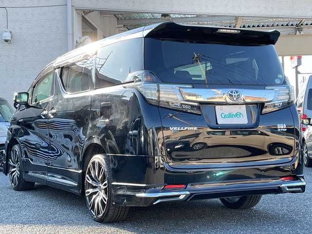 トヨタ ヴェルファイア ハイブリット V 埼玉県 2015(平27)年 13.2万km 黒 ・社外エアロ/・ワーク20インチアルミ/・純正ナビ　BT/TV/・後席モニター/・バック＆フロントカメラ/・ETC/・ドライブレコーダー/・電動パーキング/・両側パワースライドドア/・電動リアゲート/・ブレーキホールド/・ステアリングスイッチ/・レーダークルコン/・衝突軽減ブレーキ/・横滑り防止/・オットマン/・前席パワーシート/・シートメモリー/・純正フロアマット/・ドアバイザー/・ウッドコンビステアリング/・スマートキー×２/・プッシュスタート/・保証書/・取説