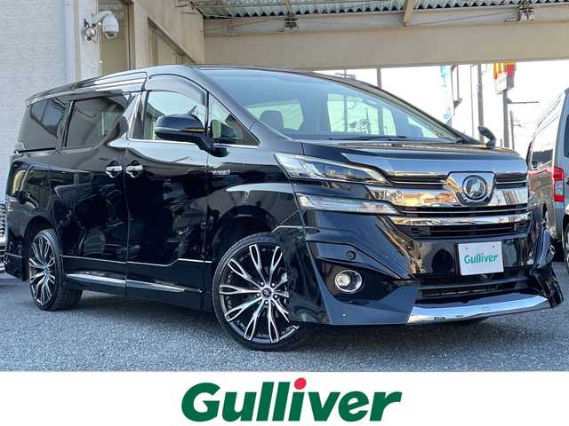 トヨタ ヴェルファイア ハイブリット V 埼玉県 2015(平27)年 13.2万km 黒 ・社外エアロ/・ワーク20インチアルミ/・純正ナビ　BT/TV/・後席モニター/・バック＆フロントカメラ/・ETC/・ドライブレコーダー/・電動パーキング/・両側パワースライドドア/・電動リアゲート/・ブレーキホールド/・ステアリングスイッチ/・レーダークルコン/・衝突軽減ブレーキ/・横滑り防止/・オットマン/・前席パワーシート/・シートメモリー/・純正フロアマット/・ドアバイザー/・ウッドコンビステアリング/・スマートキー×２/・プッシュスタート/・保証書/・取説