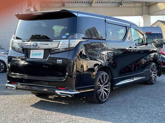 トヨタ ヴェルファイア ハイブリット V 埼玉県 2015(平27)年 13.2万km 黒 ・社外エアロ/・ワーク20インチアルミ/・純正ナビ　BT/TV/・後席モニター/・バック＆フロントカメラ/・ETC/・ドライブレコーダー/・電動パーキング/・両側パワースライドドア/・電動リアゲート/・ブレーキホールド/・ステアリングスイッチ/・レーダークルコン/・衝突軽減ブレーキ/・横滑り防止/・オットマン/・前席パワーシート/・シートメモリー/・純正フロアマット/・ドアバイザー/・ウッドコンビステアリング/・スマートキー×２/・プッシュスタート/・保証書/・取説