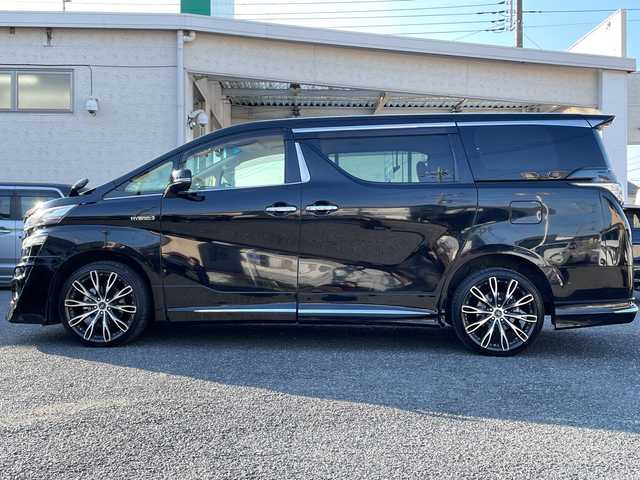 トヨタ ヴェルファイア ハイブリット V 埼玉県 2015(平27)年 13.2万km 黒 ・社外エアロ/・ワーク20インチアルミ/・純正ナビ　BT/TV/・後席モニター/・バック＆フロントカメラ/・ETC/・ドライブレコーダー/・電動パーキング/・両側パワースライドドア/・電動リアゲート/・ブレーキホールド/・ステアリングスイッチ/・レーダークルコン/・衝突軽減ブレーキ/・横滑り防止/・オットマン/・前席パワーシート/・シートメモリー/・純正フロアマット/・ドアバイザー/・ウッドコンビステアリング/・スマートキー×２/・プッシュスタート/・保証書/・取説