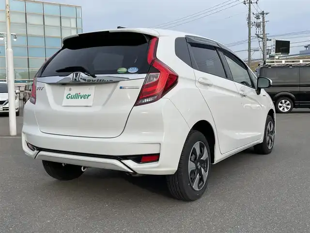ホンダ フィット ハイブリット F 青森県 2019(令1)年 8.2万km タフタホワイトⅢ ・4WD/・禁煙車/・社外SDナビ/AM/FM/・Bluetooth/・衝突被害軽減ブレーキ/・クルーズコントロール/・バックカメラ/・レーンキープアシスト/・盗難防止装置/・横滑り防止装置/・スマートキー/・スペアキー/・HIDライト/・ダブルエアバック/・社外フロアマット/・ETC/・冬タイヤ/・取扱説明書