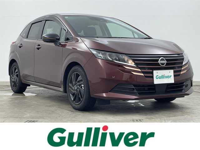 日産 ノート X 90周年記念車 岡山県 2024(令6)年 0.3万km バーガンディー 純正9インチメモリナビゲーション/【BT/USB/HDMI/フルセグTV】/プロパイロット/衝突軽減ブレーキ/アラウンドビューモニター/ビルトインETC2.0/LEDヘッドライト/デジタルインナーミラー/純正ドライブレコーダー/純正16インチアルミ/純正フロアマット/ステアリングスイッチ/アイドリングストップ/チルトステアリング/ウィンカーミラー/シートリフター/純正ドアバイザー/横滑り防止機能/プッシュスタート/スマートキー×2/禁煙車/取扱説明書/ナビ取扱説明書