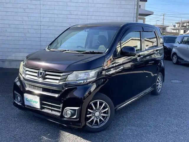 ホンダ Ｎ ＷＧＮ カスタム G ターボパッケージ 大分県 2015(平27)年 13.9万km プレミアムゴールドパープルパール ・ワンオーナー/・社外ナビ　CN-R300D/　ワンセグテレビ/　DVD/CD/　Bluetooth/　SD/　ラジオ/　AUX/・ETC/・横滑り制御システム/・ヒルスタートアシスト機能/・アイドリングストップ/・エマージェンシーストップシグナル/・クルーズコントロール/・ステアリングスイッチ/・パドルシフト/・チルトステアリング/・革巻きステアリング/・ウィンカーミラー/・プライバシーガラス/・純正フロアマット/・純正14インチアルミホイル/・ドアバイザー/・スペアキー１本/・保証書/・オーナーズマニュアル