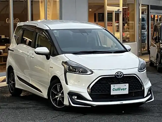トヨタ シエンタ ハイブリッド G クエロ 山口県 2019(令1)年 7.5万km ホワイトパールクリスタルシャイン モデリスタアンダーエアロ/純正9型メモリーナビ＆フルセグTV/パノラミックビューカメラ/純正フロアマット/純正ドアバイザー/社外15インチアルミ/両側パワースライドドア/クルーズコントロール/オートライト/オートハイビーム/ステアリングヒーター/フロントシートヒーター/ビルトインETC2.0