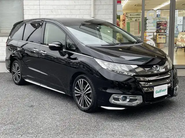 ホンダ オデッセイ アブソルート・EXホンダセンジング 埼玉県 2018(平30)年 6.7万km クリスタルブラックパール コーナーセンサー/パワーシート/メーカーオプションメモリーナビ（AM/FM/DISC/USB/i-pod/Bluetooth/フルセグTV）/両側パワースライドドア/クルーズコントロール（追従）/レーンアシスト/トラクションコントロールシステム/衝突軽減ブレーキ/アイドリングストップ/フリップダウンモニター/パーキングセンサー/パドルシフト/オートライト/パーキングアシスト/電動格納ミラー/ビルドインETC/ドライブレコーダー/純正フロアマット/プッシュスタート/オットマン
