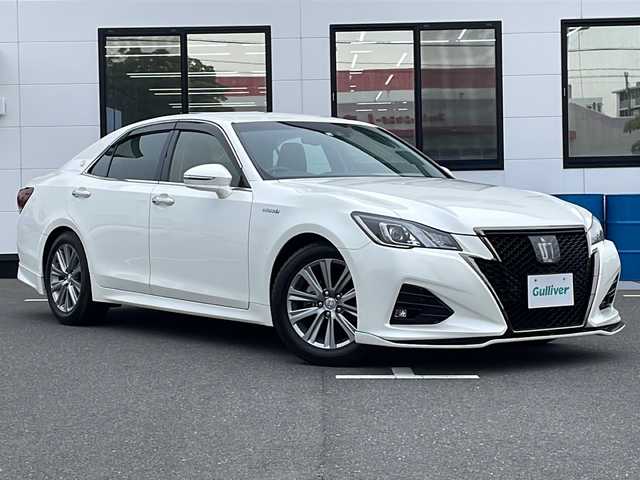 トヨタ クラウン ハイブリッド アスリートSJ-フロンティアLTD 山口県 2018(平30)年 5.5万km ホワイトパールクリスタルシャイン シルクブレイズCronusエアロ/SenせBrandマフラー/メーカーナビ/　・フルセグテレビ/　・Bluetoothオーディオ/　・FM/AMラジオ/　・CD/DVD再生/　・SDカード音楽録音/　・SDカード再生/　・AUX/切替スイッチ付TVキット/バックカメラ/クルーズコントロール/プリクラッシュアシストブレーキ/レーンキープアシスト/オートハイビーム/コーナーセンサー/シートヒーター/ステアリングヒーター/タッチパネルデュアルオートAC/ビルトインETC/D席/N席パワーシート/パワーチルトテレスコピックステアリング/ステアリングリモコン/ウッドコンピ革巻ステアリング/マルチインフォメーションディスプレイ/純正フロアマット/純正17インチAW/ハーフレザーシート/LEDオートライト/LEDフォグランプ/LEDミラーウィンカー/LED室内灯/アームレストコンソール/WSRS＋サイドカーテンエアバッグ/後席ISPFIXシート/取扱説明書/ナビ取扱説明書/保証書/スマートキー/イモビライザー/プッシュスタート