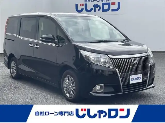 トヨタ エスクァイア Xi 埼玉県 2015(平27)年 12.3万km ブラック (株)IDOMが運営する【じしゃロン鳩ヶ谷店】の自社ローン専用車両になりますこちらは現金またはオートローンご利用時の価格です。自社ローンご希望の方は別途その旨お申付け下さい/登録時122204km/左側パワースライドドア/社外SDナビ（KENWOOD MDV-L502W）/　・AM/FM/CD/DVD/MSV(SD)/BT/フルセグTV/バックカメラ/社外フリップダウンモニター（EONON　L0122)/ETC/社外ミラーレーダー（COMTEC　ZERO502M）/LEDヘッドライト/　・オートライト/フォグランプ/革巻ステアリング/革巻シフトノブ/キーレスエントリー/電動格納機能付きウインカーミラー/純正15インチAW