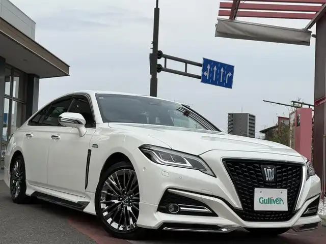 トヨタ クラウン ハイブリッド G－エグゼクティブ 香川県 2019(平31)年 7万km ホワイトパールクリスタルシャイン メーカーナビ/フルセグ/CD/DVV/Bluetooth/パノラミックビューモニター/モデリスタエアロ/純正18インチアルミ/クリアランスソナー/LEDヘッドライト/デジタルインナーミラー/黒革シート/全席シートヒーター/全席パワーシート/前席シートベンチレーション/全ドアイージークローザー/パーキングアシスト/オートハイビーム/レーダークルーズ/レーンキープアシスト/ビルトインETC