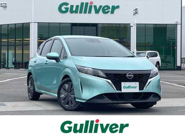 日産 ノート X 愛媛県 2023(令5)年 6.8万km 緑 プッシュスタート/純正ナビ（AM/FM/Bluetooth/フルセグTV）/アラウンドビューモニター/ETC２．０/横滑り防止装置/レーンキープアシスト/オートライト/オートマチックハイビーム/コーナーセンサー/クルーズコントロール