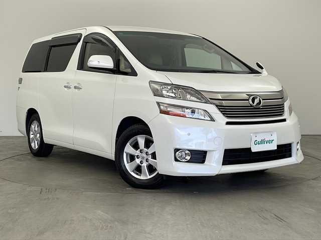 トヨタ ヴェルファイア 2．4X 兵庫県 2014(平26)年 9.8万km ホワイトパールクリスタルシャイン ・社外9インチナビ/CD/DVD/SD/TV/・フリップダウンモニター/・ETC/・クルーズコントロール/・前後ドライブレコーダー/・HIDヘッドライト/・HIDフォグランプ/・両側パワースライドドア/・純正16インチアルミホイール/・純正フロアマット/・ステアリングスイッチ/・横滑り防止装置/・クリアランスソナー/・スマートキー/・プッシュスタート/・デュアルエアコン/・カーテンエアバック