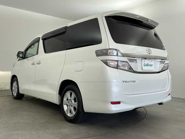トヨタ ヴェルファイア 2．4X 兵庫県 2014(平26)年 9.8万km ホワイトパールクリスタルシャイン ・社外9インチナビ/CD/DVD/SD/TV/・フリップダウンモニター/・ETC/・クルーズコントロール/・前後ドライブレコーダー/・HIDヘッドライト/・HIDフォグランプ/・両側パワースライドドア/・純正16インチアルミホイール/・純正フロアマット/・ステアリングスイッチ/・横滑り防止装置/・クリアランスソナー/・スマートキー/・プッシュスタート/・デュアルエアコン/・カーテンエアバック