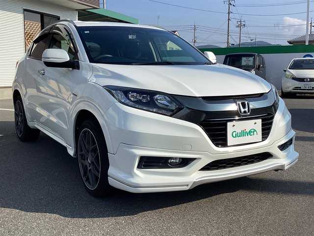 ホンダ ヴェゼル ハイブリッド Z 岡山県 2014(平26)年 6万km ホワイトオーキッドパール 純正ナビ/Bluetooth/フルセグTV/バックカメラ/ETC/ハーフレザーシート/Ｄ/Ｎシートヒーター/ドラレコ/社外18ＡＷ/LEDヘッドライト/オートライト/衝突軽減ブレーキ/クルーズコントロール/パドルシフト/スマートキー/プッシュスタート