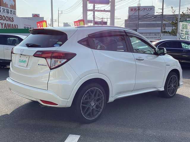 ホンダ ヴェゼル ハイブリッド Z 岡山県 2014(平26)年 6万km ホワイトオーキッドパール 純正ナビ/Bluetooth/フルセグTV/バックカメラ/ETC/ハーフレザーシート/Ｄ/Ｎシートヒーター/ドラレコ/社外18ＡＷ/LEDヘッドライト/オートライト/衝突軽減ブレーキ/クルーズコントロール/パドルシフト/スマートキー/プッシュスタート
