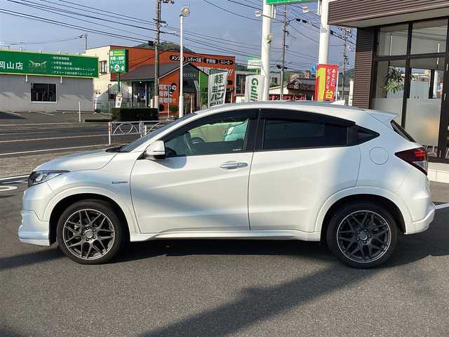ホンダ ヴェゼル ハイブリッド Z 岡山県 2014(平26)年 6万km ホワイトオーキッドパール 純正ナビ/Bluetooth/フルセグTV/バックカメラ/ETC/ハーフレザーシート/Ｄ/Ｎシートヒーター/ドラレコ/社外18ＡＷ/LEDヘッドライト/オートライト/衝突軽減ブレーキ/クルーズコントロール/パドルシフト/スマートキー/プッシュスタート