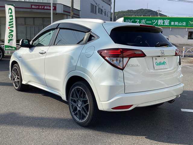 ホンダ ヴェゼル ハイブリッド Z 岡山県 2014(平26)年 6万km ホワイトオーキッドパール 純正ナビ/Bluetooth/フルセグTV/バックカメラ/ETC/ハーフレザーシート/Ｄ/Ｎシートヒーター/ドラレコ/社外18ＡＷ/LEDヘッドライト/オートライト/衝突軽減ブレーキ/クルーズコントロール/パドルシフト/スマートキー/プッシュスタート