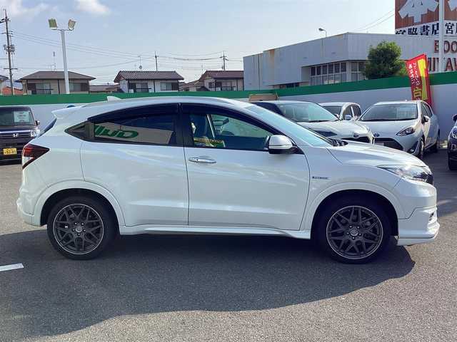ホンダ ヴェゼル ハイブリッド Z 岡山県 2014(平26)年 6万km ホワイトオーキッドパール 純正ナビ/Bluetooth/フルセグTV/バックカメラ/ETC/ハーフレザーシート/Ｄ/Ｎシートヒーター/ドラレコ/社外18ＡＷ/LEDヘッドライト/オートライト/衝突軽減ブレーキ/クルーズコントロール/パドルシフト/スマートキー/プッシュスタート