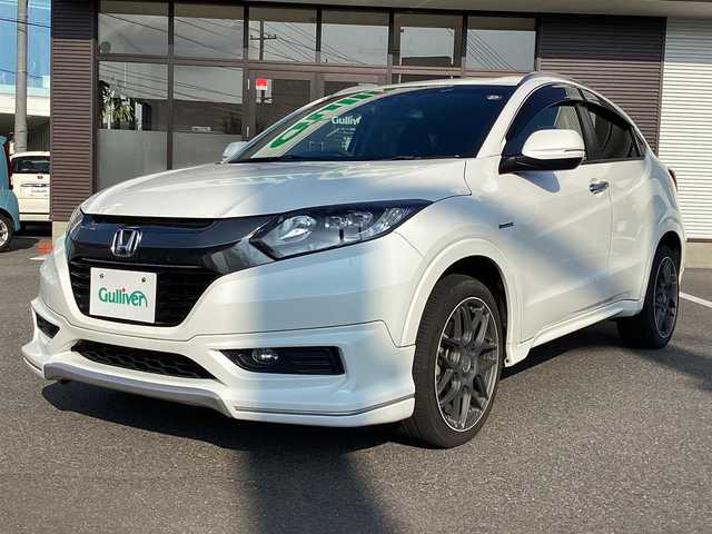 ホンダ ヴェゼル ハイブリッド Z 岡山県 2014(平26)年 6万km ホワイトオーキッドパール 純正ナビ/Bluetooth/フルセグTV/バックカメラ/ETC/ハーフレザーシート/Ｄ/Ｎシートヒーター/ドラレコ/社外18ＡＷ/LEDヘッドライト/オートライト/衝突軽減ブレーキ/クルーズコントロール/パドルシフト/スマートキー/プッシュスタート