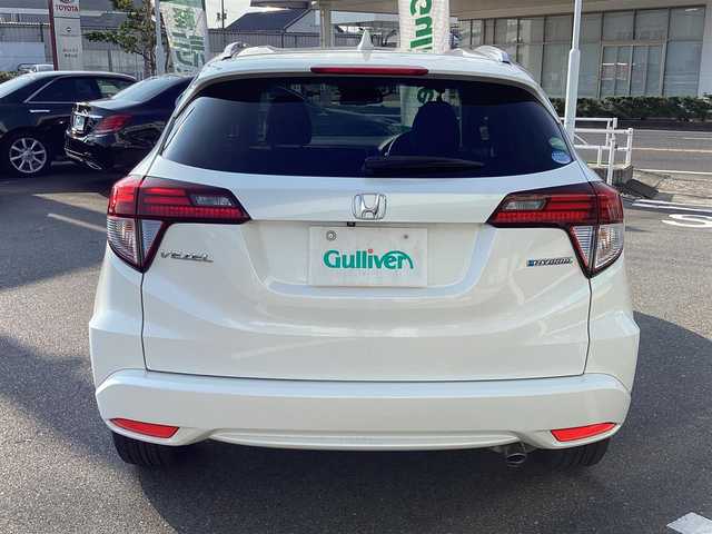 ホンダ ヴェゼル ハイブリッド Z 岡山県 2014(平26)年 6万km ホワイトオーキッドパール 純正ナビ/Bluetooth/フルセグTV/バックカメラ/ETC/ハーフレザーシート/Ｄ/Ｎシートヒーター/ドラレコ/社外18ＡＷ/LEDヘッドライト/オートライト/衝突軽減ブレーキ/クルーズコントロール/パドルシフト/スマートキー/プッシュスタート