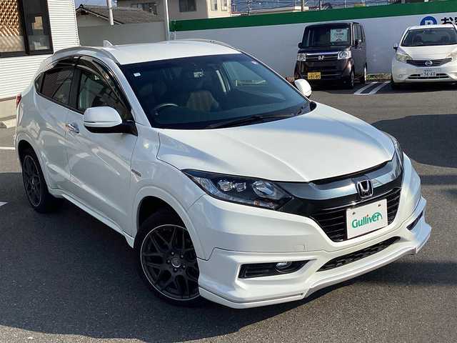 ホンダ ヴェゼル ハイブリッド Z 岡山県 2014(平26)年 6万km ホワイトオーキッドパール 純正ナビ/Bluetooth/フルセグTV/バックカメラ/ETC/ハーフレザーシート/Ｄ/Ｎシートヒーター/ドラレコ/社外18ＡＷ/LEDヘッドライト/オートライト/衝突軽減ブレーキ/クルーズコントロール/パドルシフト/スマートキー/プッシュスタート