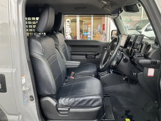 スズキ ジムニー XC 滋賀県 2021(令3)年 4.3万km ミディアムグレー 純正9インチナビゲーション/・Bluetooth・フルセグTV/FRPボンネット/FRバンパー（ショウワガレージ）/スキッドプレート（ショウワガレージ）/マフラー（ショウワガレージ）/テールランプ（ショウワガレージ）/フロントグリル（ショウワガレージ）/エアクリーナー（GReddy)/ブローオフバルブ（GReddy)/インタークーラ（GReddy)/シャックアブソーバー14段階調節式（タニグチ）/サスペンションスプリング/ラテラルロッド/オイルキャッチタンク/HKSブーストコントローラー（powerEditor)/社外フロントカメラ/ブーストメーター（Pivot）/ステアリング（ナルディー）/アルパインデジタルインナーミラー/・前後ドライブレコーダー付き/社外16AW（Toyoオープンカントリー）/ビルトインETC/保証書・取説・スペアキー/