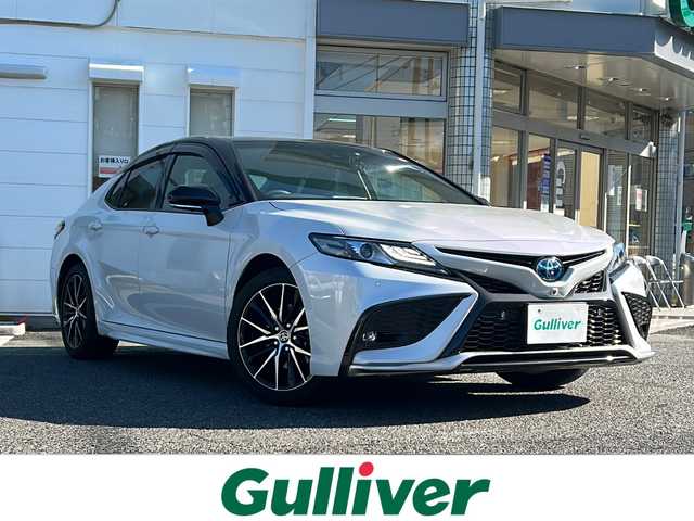 トヨタ カムリ WSレザーパッケージ 愛知県 2023(令5)年 0.8万km アティチュードブラックマイカ/プラチナホワイトパールマイカ /禁煙車/ワンオーナー//9インチディスプレイオーディオ//Tコネクトナビ/フルセグTV//Bluetooth・USB//バックカメラ・パノラミックビューモニター//ビルトインETC2.0//前後ドライブレコーダー//カラーヘッドアップディスプレイ//トヨタセーフティセンス//プリクラッシュセーフティ//レーントレーシングアシスト//オートマチックハイビーム//ロードサインアシスト//レーダークルーズコントロール/　（全車速追従機能付き）//ブラインドスポットモニター//クリアランスソナー//リアクロストラフィックアラート//パーキングサポートブレーキ//黒本革シート//前席シートヒーター//前席パワーシート//パドルシフト//純正１８インチアルミ//本革巻きステアリング//電動チルトステアリング//電動パーキング・ブレーキホールド//ISOFIX//LEDオートライト//電動格納ミラーウィンカー//純正フロアマット//純正ドアバイザー//取扱説明書//新車保証書//スペアキー