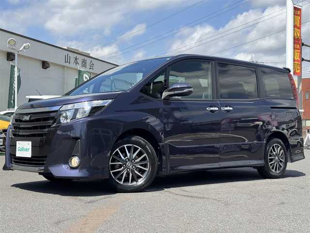 トヨタ ノア Si ダブルバイビー 千葉県 2017(平29)年 2.6万km ダークバイオレットマイカメタリック ワンオーナー/プリクラッシュセーフティ/レーンキープアシスト/クルーズコントロール/純正9インチナビ/バックカメラ/AM/FM/CD/DVD/BT/フルセグTV/TVキャンセラー切替スイッチ付/ビルトインETC/両側パワースライドドア/ハーフレザーシート/2列目ロールサンシェード/ハーフレザーシート/アイドリングストップ/オートマチックハイビーム/オールオートパワーウィンドウ/純正フロアマット/純正ラゲージパーテーションケース/純正16インチAW/LEDヘッドライト/スペアキー1本/保証書・取説/H29・30・R1~6記録簿